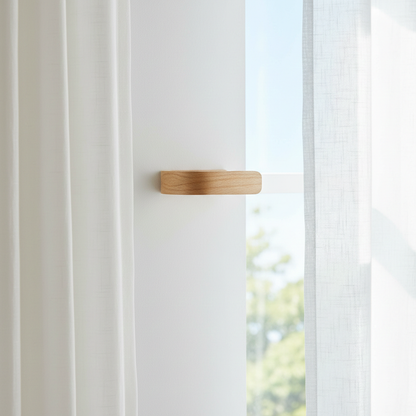 Wooden Holdbacks on a white wall with a blurred outdoor background