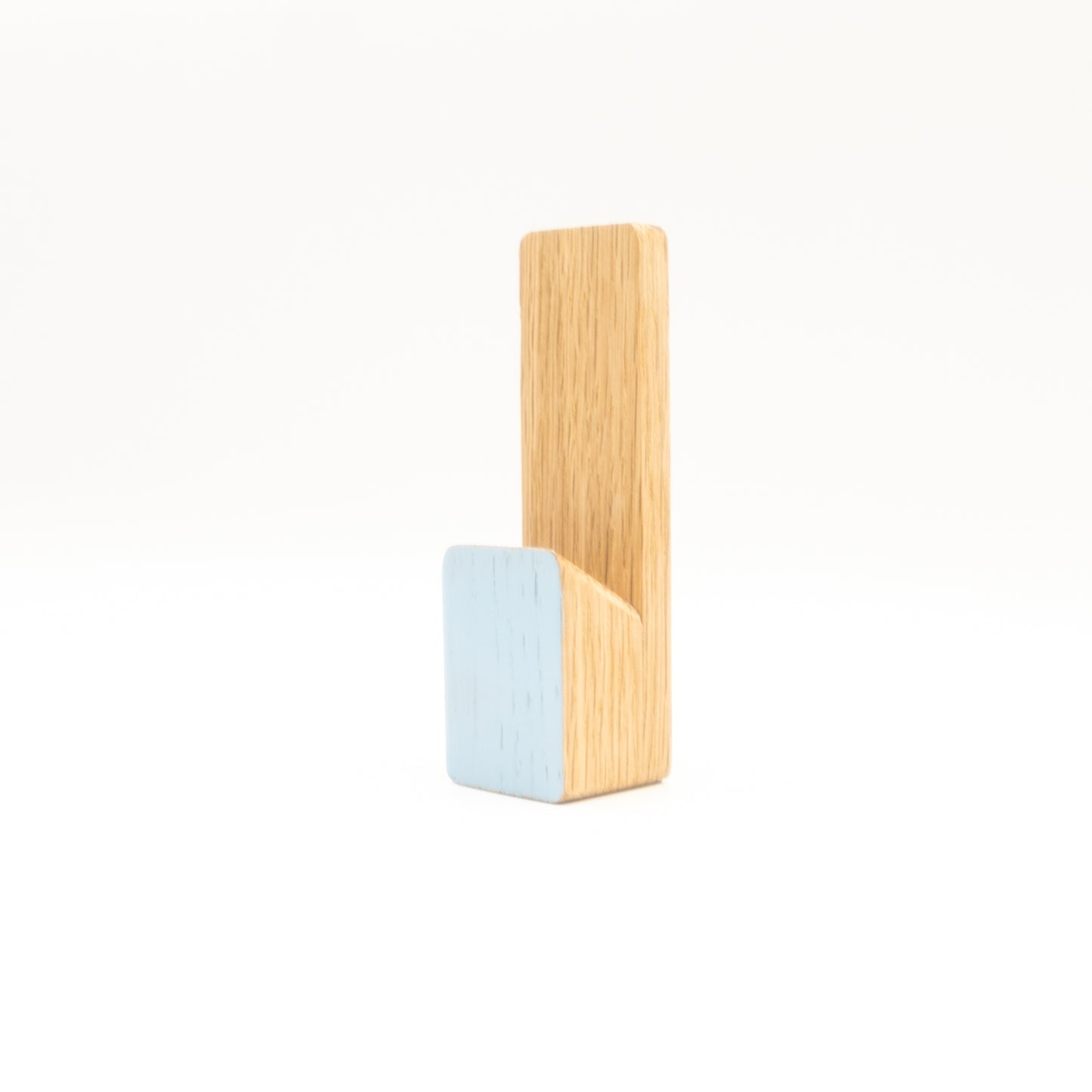 Wooden and light blue wall hook on a white background