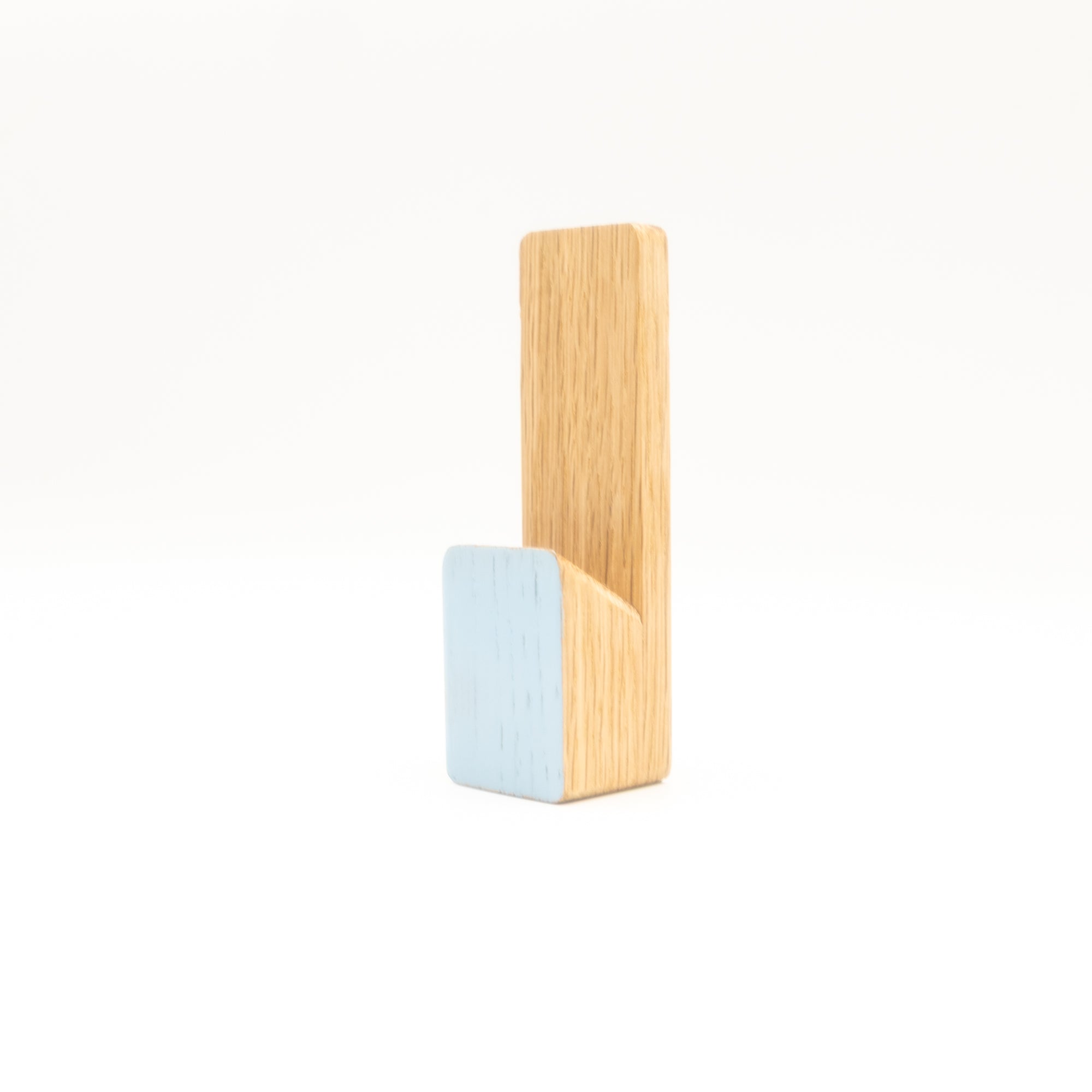 Wooden and light blue wall hook on a white background